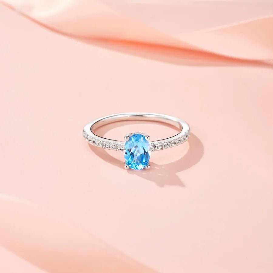 Oval Blue Topaz & CZ Halo Ring | S925 Silver 18K Gold Plated | 5×7mm Egg-Shape Center | 16 Pavé Stones | Charmsolo
