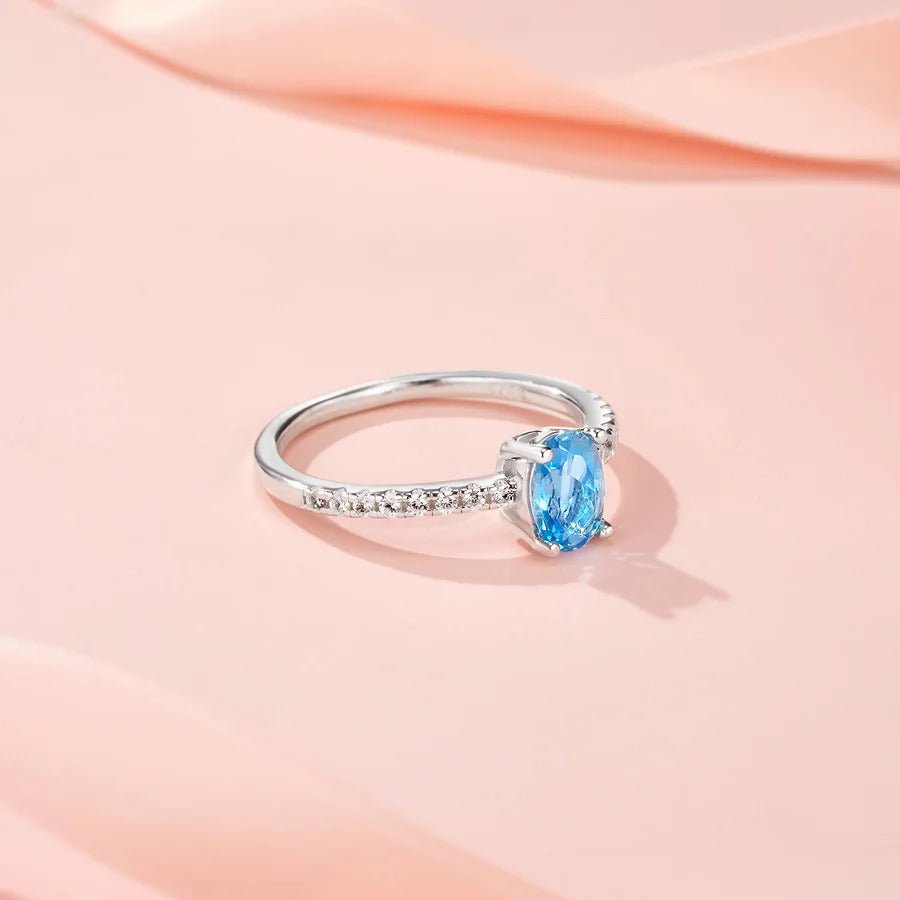 Oval Blue Topaz & CZ Halo Ring | S925 Silver 18K Gold Plated | 5×7mm Egg-Shape Center | 16 Pavé Stones | Charmsolo
